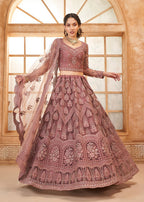 Mauve Pink Heavy Embroidered Bridal Lehenga with Sheer Sleeves & Net Dupatta